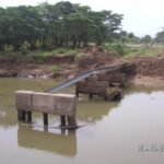 A tramline bridge bruised and battered by the April floods