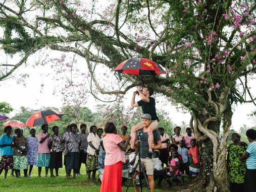 Josh Flavell (The Price of Conflict cinematographer) and Chris Panzetta (Director) set up a 360-degree shot under the bougainvillea in Oria village, Konnou, Bougainville, PNG (image: World Bank/Alana Holmberg)