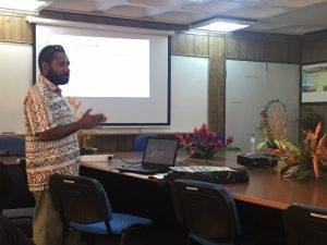 Peter Kanaparo makes a point at PNG's education department (image: Amanda Watson)