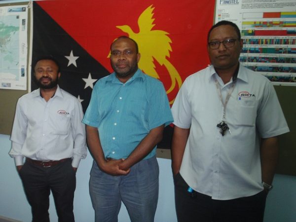 Hans Adeg, Gibson Tito and Kila Aluvula at their workplace in Port Moresby