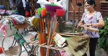 Bicycle broom seller, Hanoi (image: CARE)