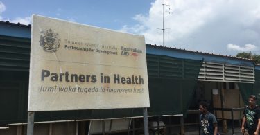 Australian aid sign at the National Referral Hospital, Honiara (Credit: Camilla Burkot)
