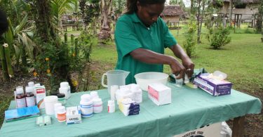 Nurse sets up for a village health clinic, PNG 2009 (DFAT/Flickr/CC by 2.0)