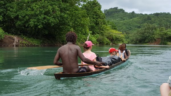 Our worker Allen with Kate, Jack and family children, travelling from the village on the Kwarare River