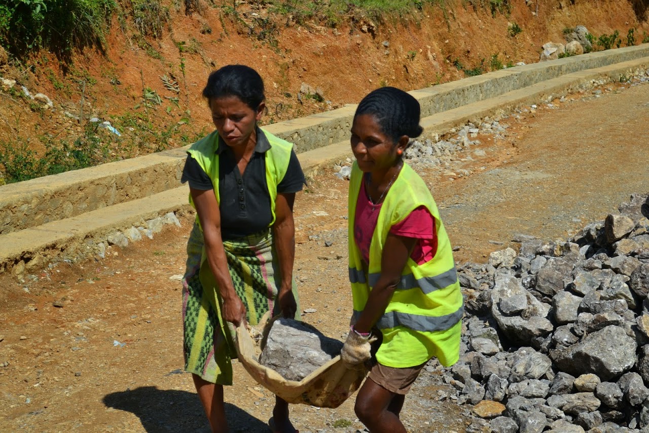 Women work on the Road for Development Programme in Timor-Leste; the improved road access for rural Timorese will hopefully bring economic benefits (ILO in Asia and the Pacific/Flickr/CC BY