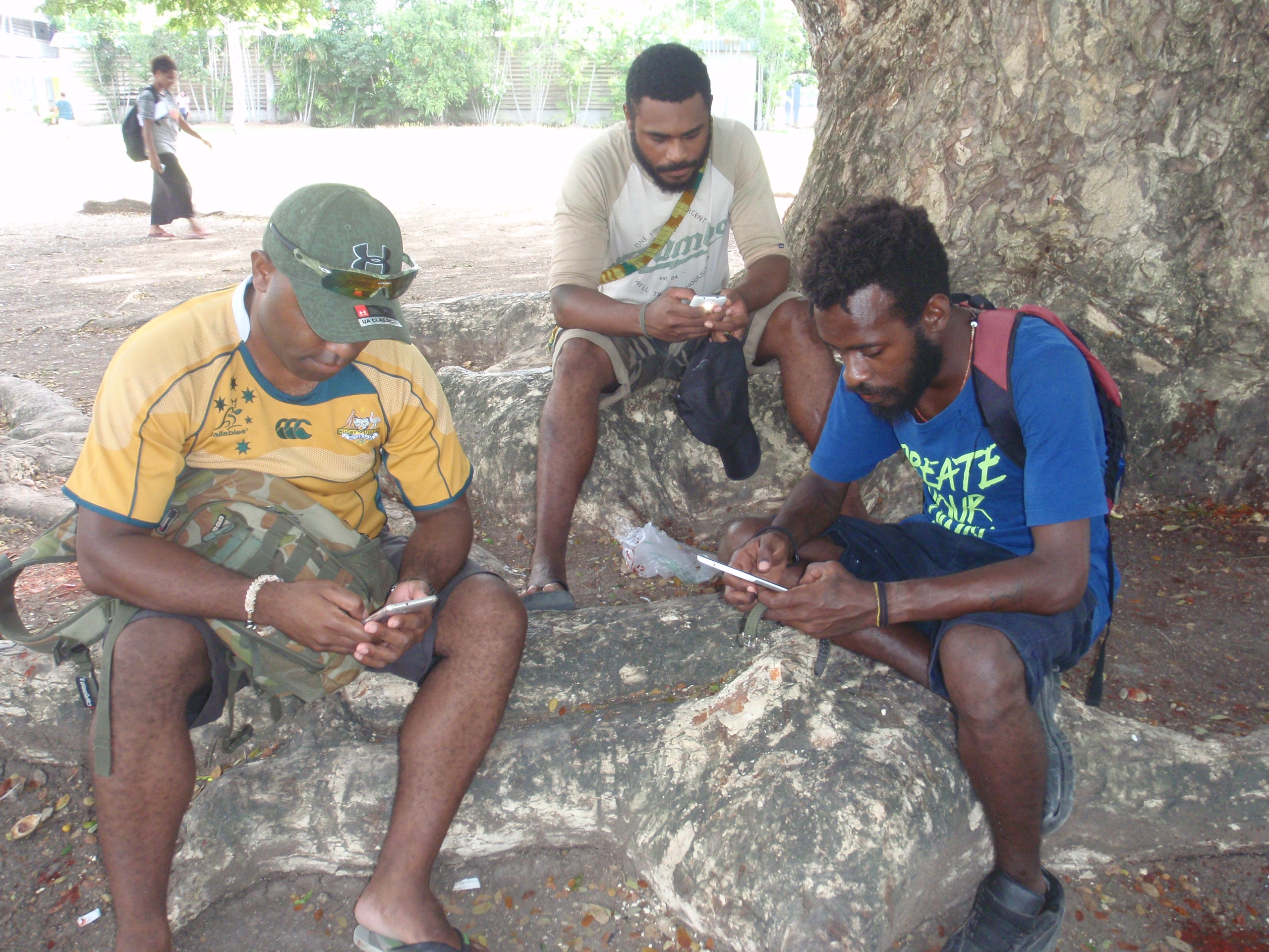 UPNG students using their mobile phones (Credit: Amanda Watson)