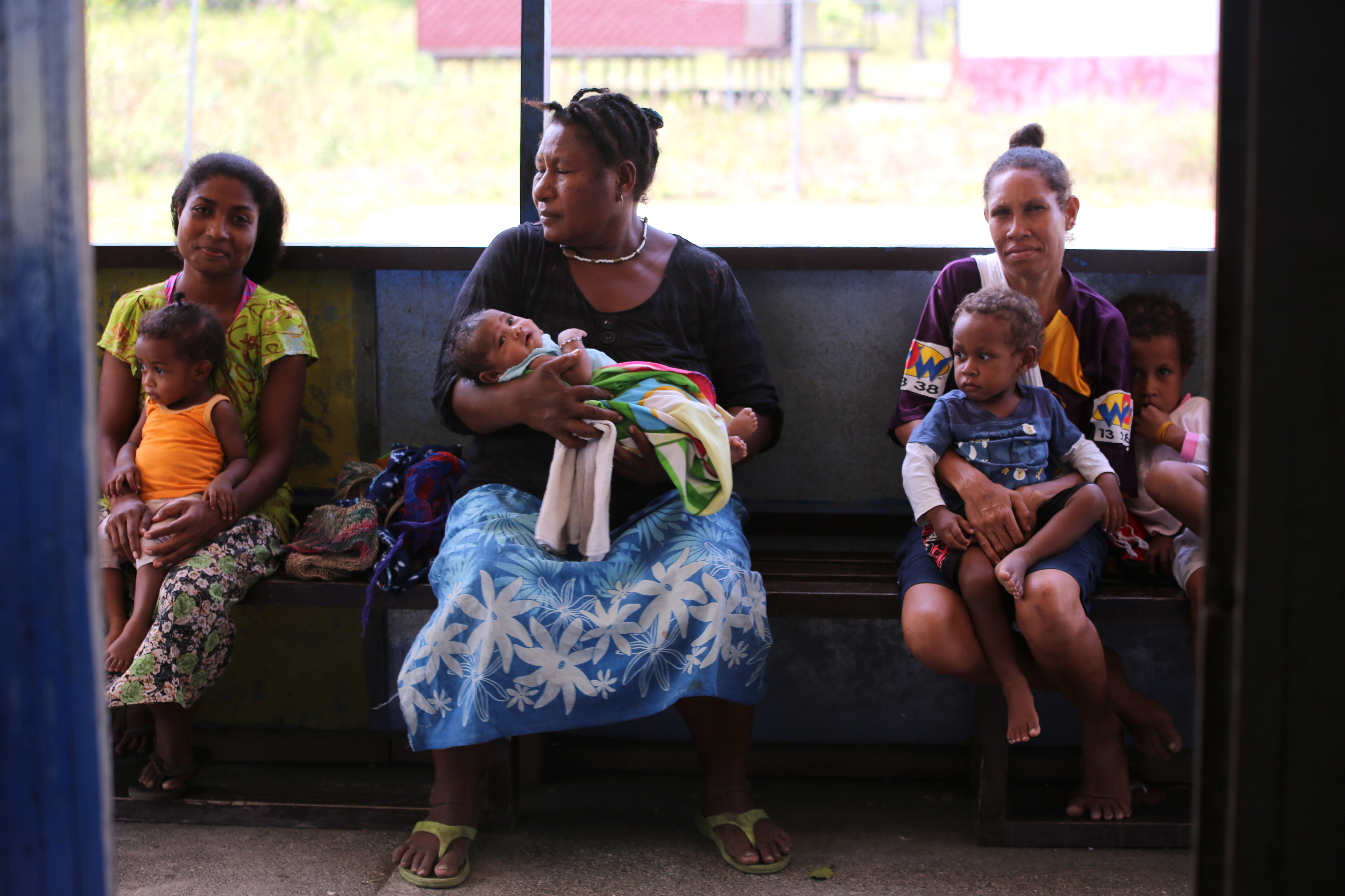 Women wait to have their children vaccinated at the Waima sub-health centre, PNG (Credit: ChildFund)