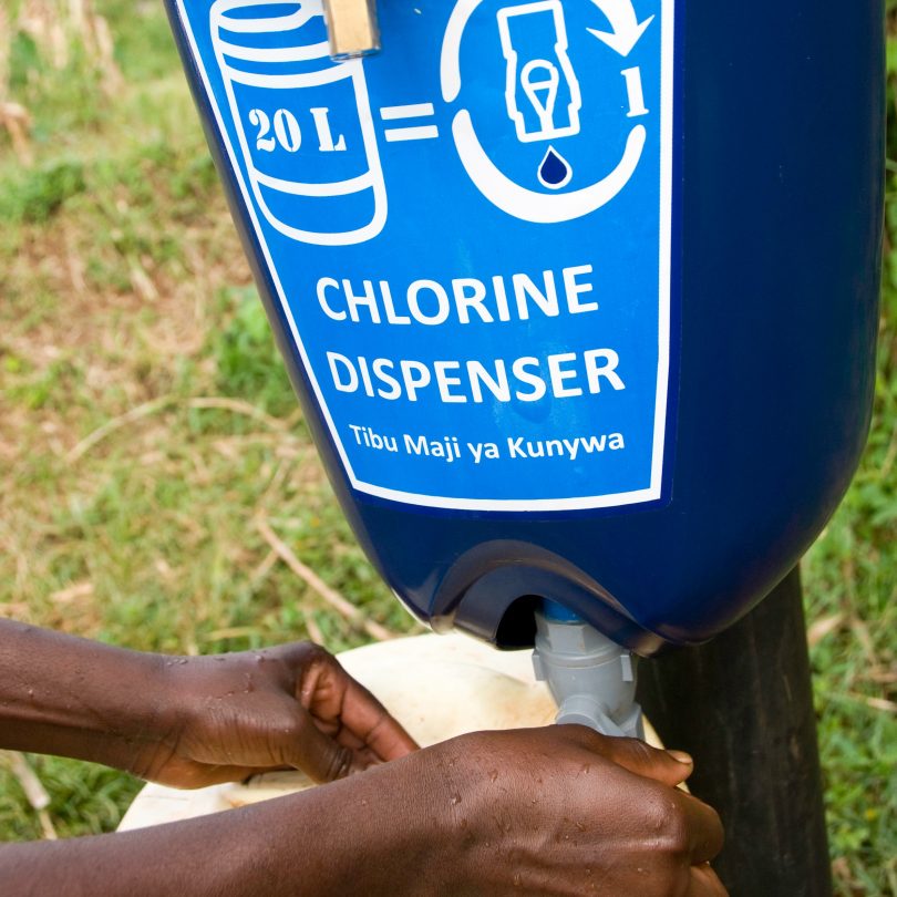 A chlorine dispenser installed as part of a randomised control trial in Kenya and Uganda (Jonathan Kalan/DIVatUSAID/Flickr/CC BY-NC-ND 2.0)