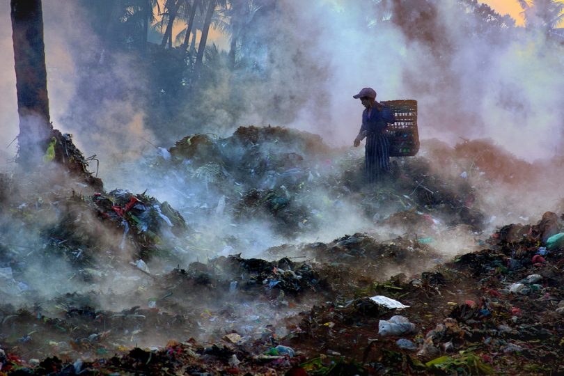 A girl searches for recyclable materials in a garbage dump, Mandalay city, Myanmar (UNDP/Flickr/CC BY-NC-ND 2.0)