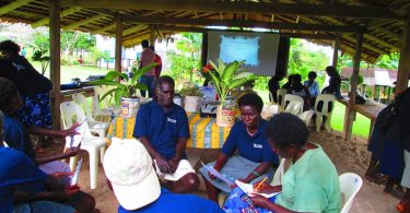 Group discussion between Local Village Health Volunteers as part of a BHCP orientation exercise in the Bana District in 2014 (Credit: BHCP)