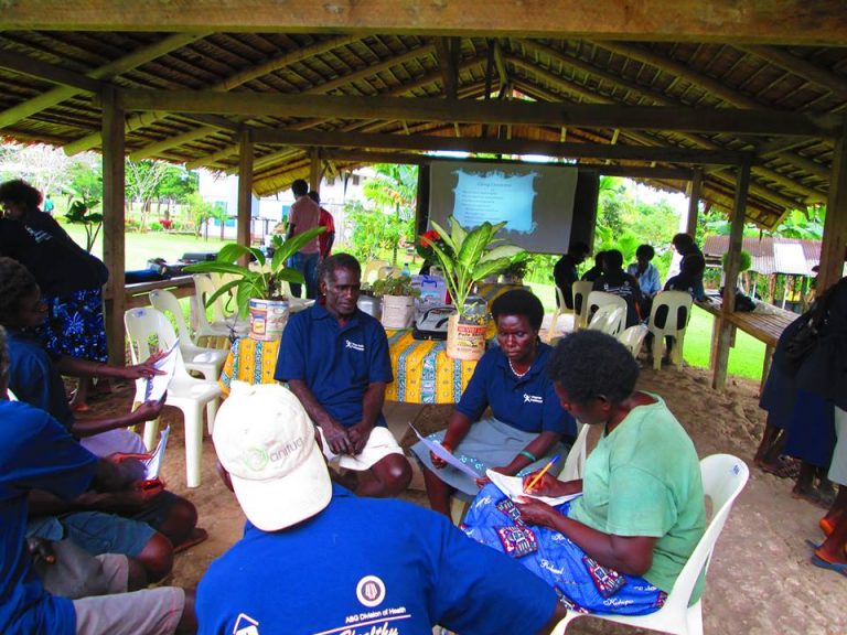 Group discussion between Local Village Health Volunteers as part of a BHCP orientation exercise in the Bana District in 2014 (Credit: BHCP)