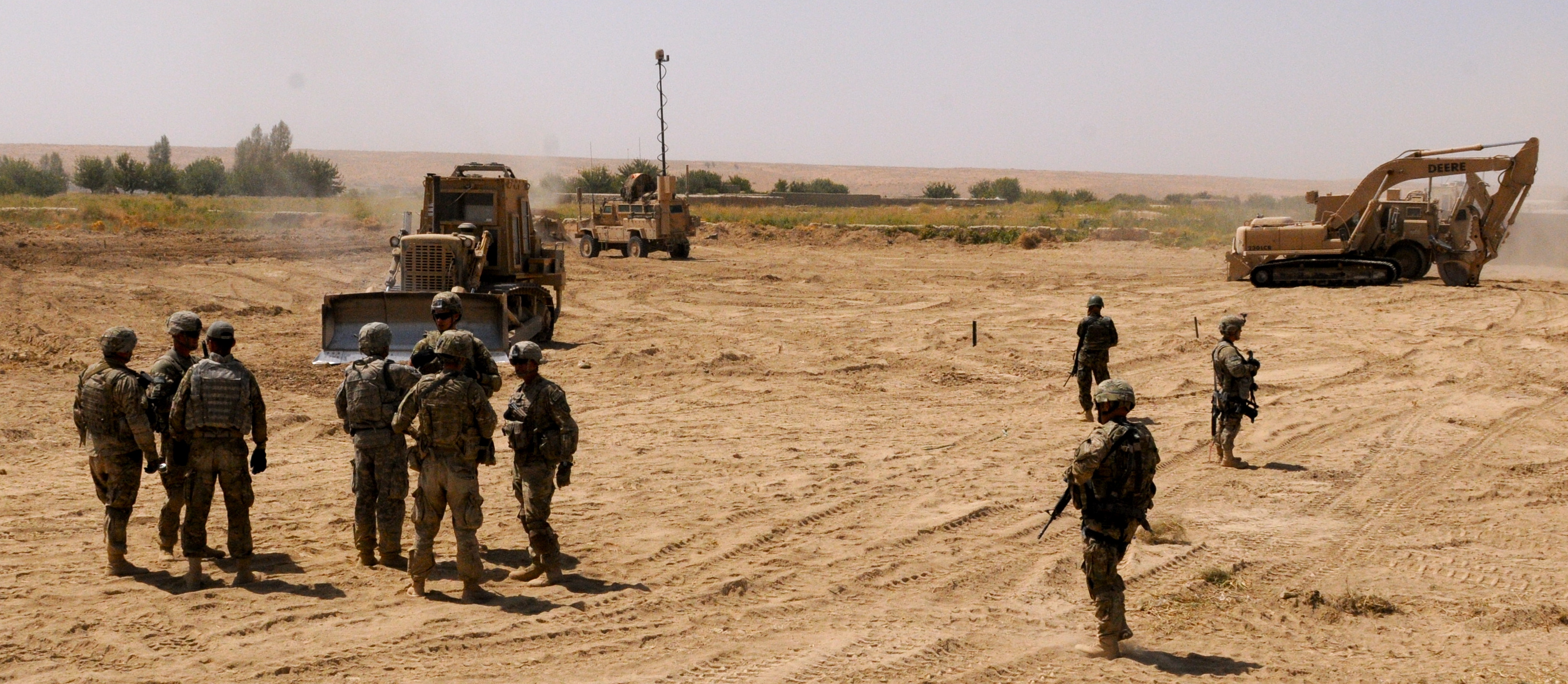 US soldiers and bulldozers clear and improve Route Agha in Afghanistan (Arctic Wolves/Flickr/CC BY 2.0)