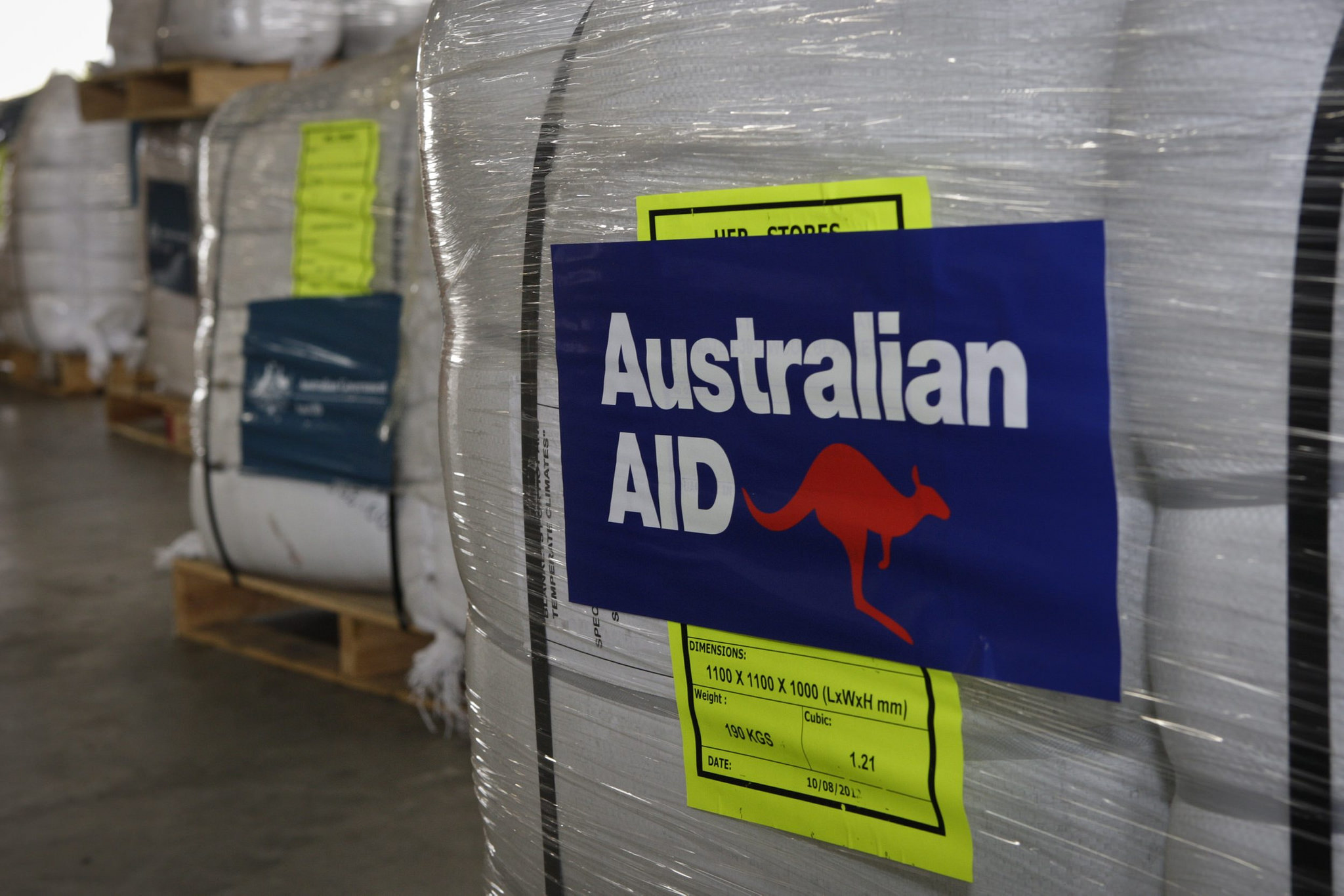 Pallets for AusAid emergency aid supplies are prepared for delivery to cyclone ravaged Fiji (DFAT/Flickr/CC BY 2.0)