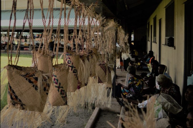 Women weaving baskets at Lorengau market, Manus Island (Credit: Michelle N Rooney)