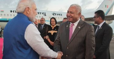 Fijian PM Bainimarama (right) greets Indian PM Modi (left) on arrival in Fiji, 2014 (Credit: Dinfo News)