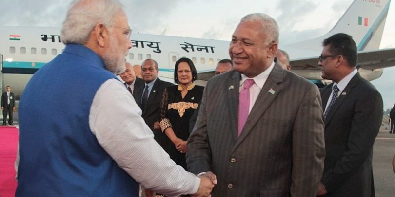 Fijian PM Bainimarama (right) greets Indian PM Modi (left) on arrival in Fiji, 2014 (Credit: Dinfo News)