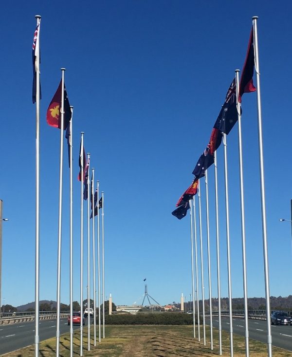 PNG flags fly at Commonwealth Bridge, Canberra (Credit: Michelle Rooney)
