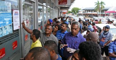 Crowds gathered outside the Fiji National Provident Fund office in Lautoka after the Budget announcement, ignoring social distancing (Credit: Fiji Times)
