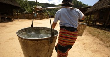 Carrying water in Lao PDR (Credit: DFAT/Flickr CC BY 2.0)