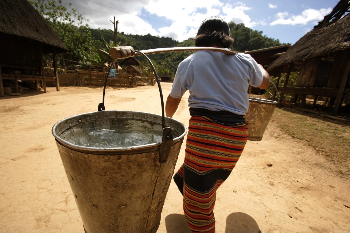 Carrying water in Lao PDR (Credit: DFAT/Flickr CC BY 2.0)