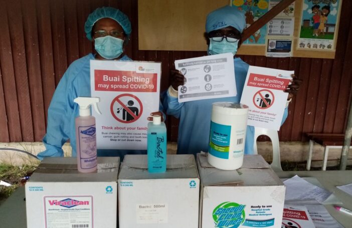 Health workers with PPE, posters and sanitizers donated by ADI in New Ireland