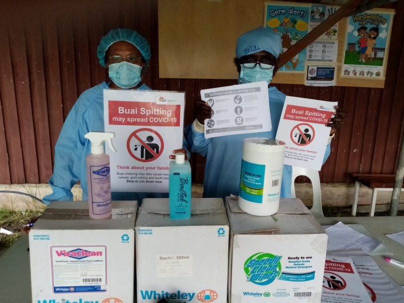 Health workers with PPE, posters and sanitizers donated by ADI in New Ireland
