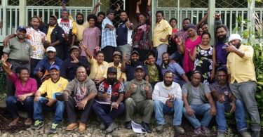 Extension officers from Coffee Industry Corporation and leaders from farmer groups attending strongim grup training in Aiyura, December 2019 (image supplied by the authors).