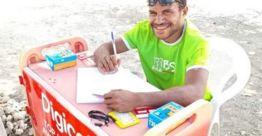 Nigel Uyam operating a registration booth in Basamuk, Madang Province, September 2020