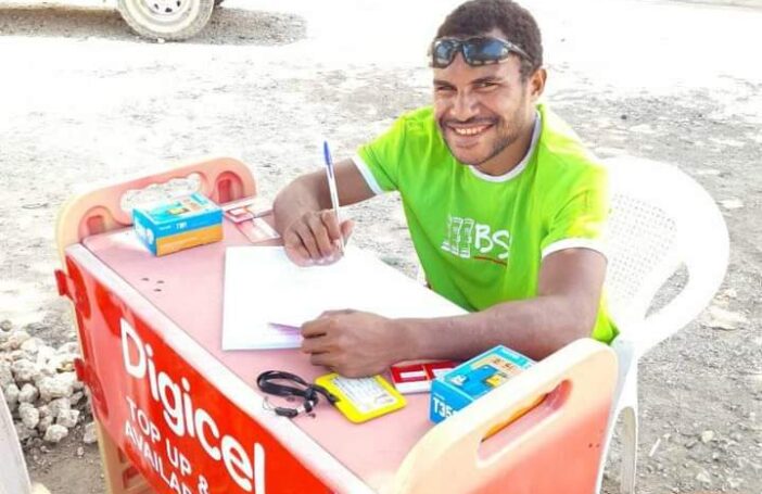 Nigel Uyam operating a registration booth in Basamuk, Madang Province, September 2020