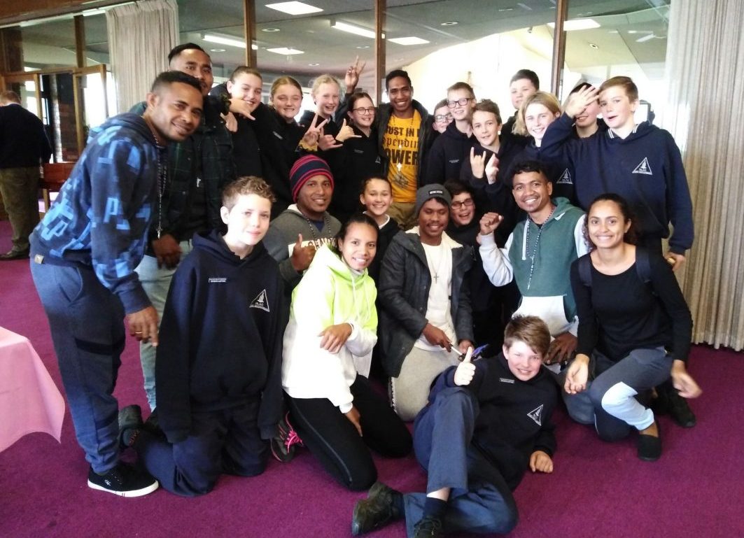 Timorese workers with friends from the local parish school in Warrnambool.