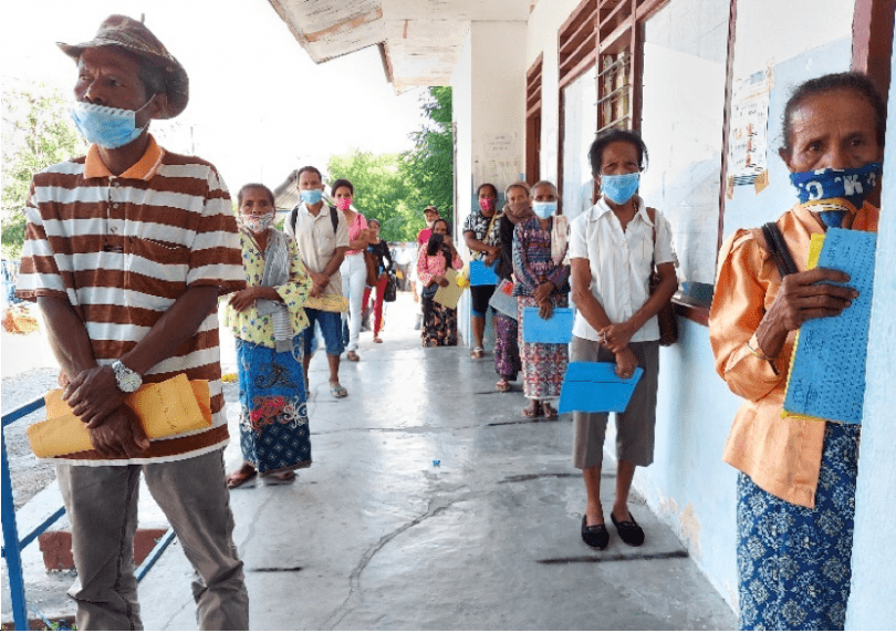 People queue outside the cash distribution centre at Suco Dato, Liquica Municipality, Timor-Leste