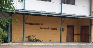 Photograph of exterior of the Postgraduate and Research Centre building at Divine Word University, Madang, PNG