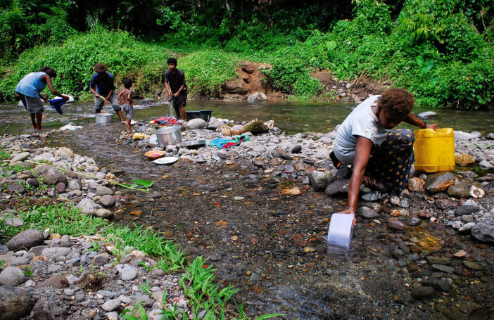 Fetching water from a stream in PNG