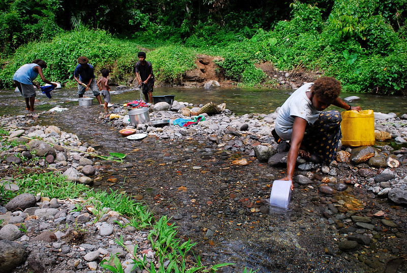 Fetching water from a stream in PNG