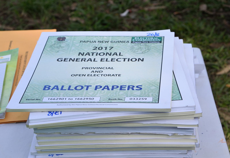 Photograph of a pile of books of ballot papers in the 2017 elections in Papua New Guinea.