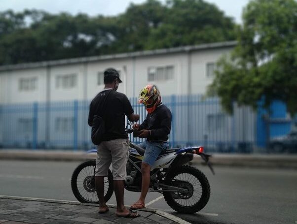 Julieto Soares selling pulsa on a street in Colmera, Dili (Aashna Jamal)