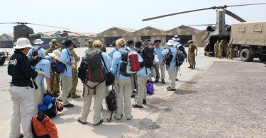 The first civilian contingent of the Australian Medical Task Force prepare to board a helicopter bound for Kot Addu.