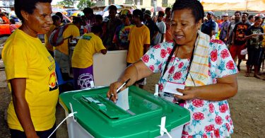A woman casts her vote in the 2012 Papua New Guinea general elections.