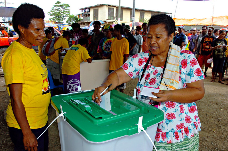 A woman casts her vote in the 2012 Papua New Guinea general elections.