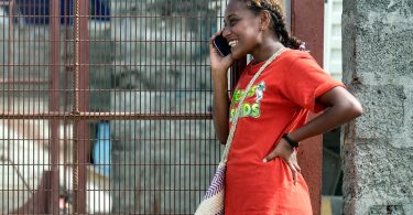 Woman using a mobile phone in Honiara, Solomon Islands (Asian Development Bank-Flickr)