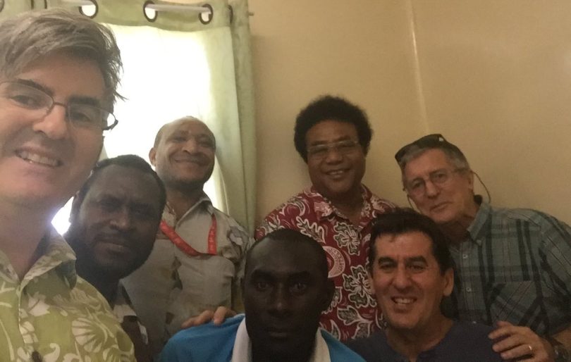 Gordon Peake (far left) and Angel Pesevski (bottom right) with colleagues in Bougainville in 2016