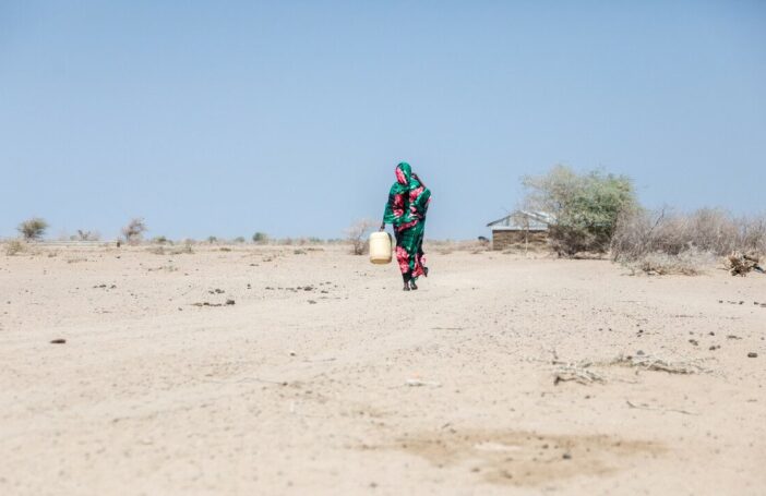 A woman outside her home in Badana, Kenya