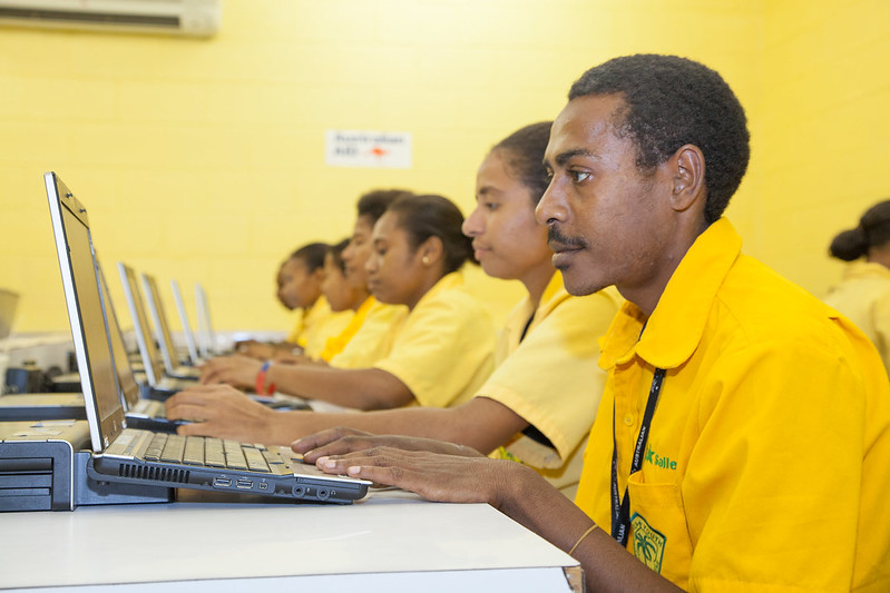 Students in IT class at The Hohola Youth Development Centre using AusAID donated laptops, 2013