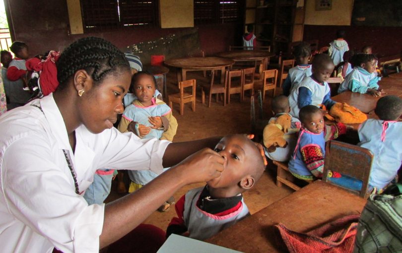 Administering polio vaccine in a nursery school in Africa (Louie Rosencrans-CDC-Flickr)