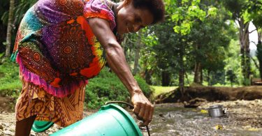 Collecting water in Yiwun village, Wewak District, PNG, August 2021 (Dion Kombeng-WaterAid)