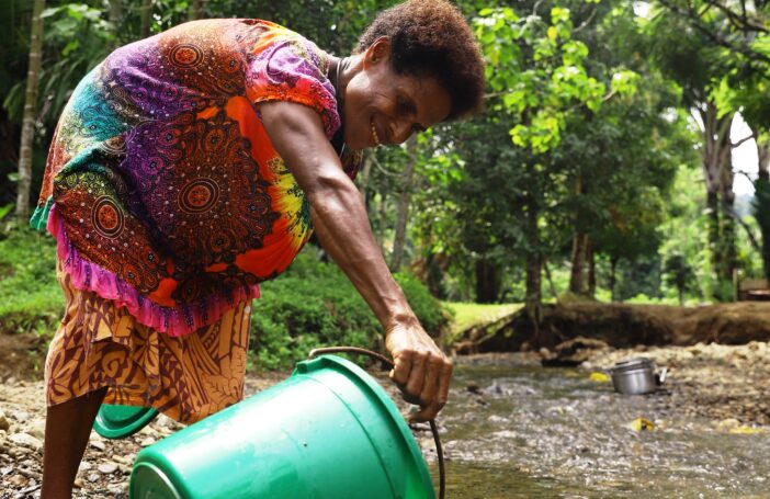 Collecting water in Yiwun village, Wewak District, PNG, August 2021 (Dion Kombeng-WaterAid)