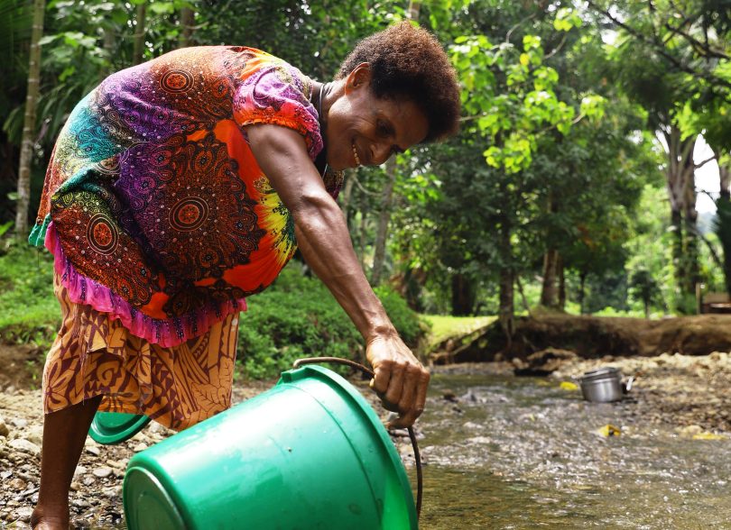 Collecting water in Yiwun village, Wewak District, PNG, August 2021 (Dion Kombeng-WaterAid)