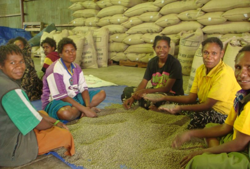 Women in the PNG Highlands sorting coffee beans (Commonwealth Secretariat-Flickr)