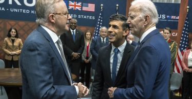 US President Joe Biden greets UK PM Rishi Sunak and Australian PM Anthony Albanese at the AUKUS bilateral meeting in March 2023.