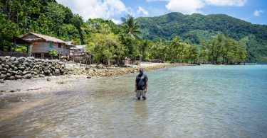 Martin Hau’ato stands where there used to be dry land and houses of Muki Community in the Solomon Islands (Ivan Utahenua-Oxfam)